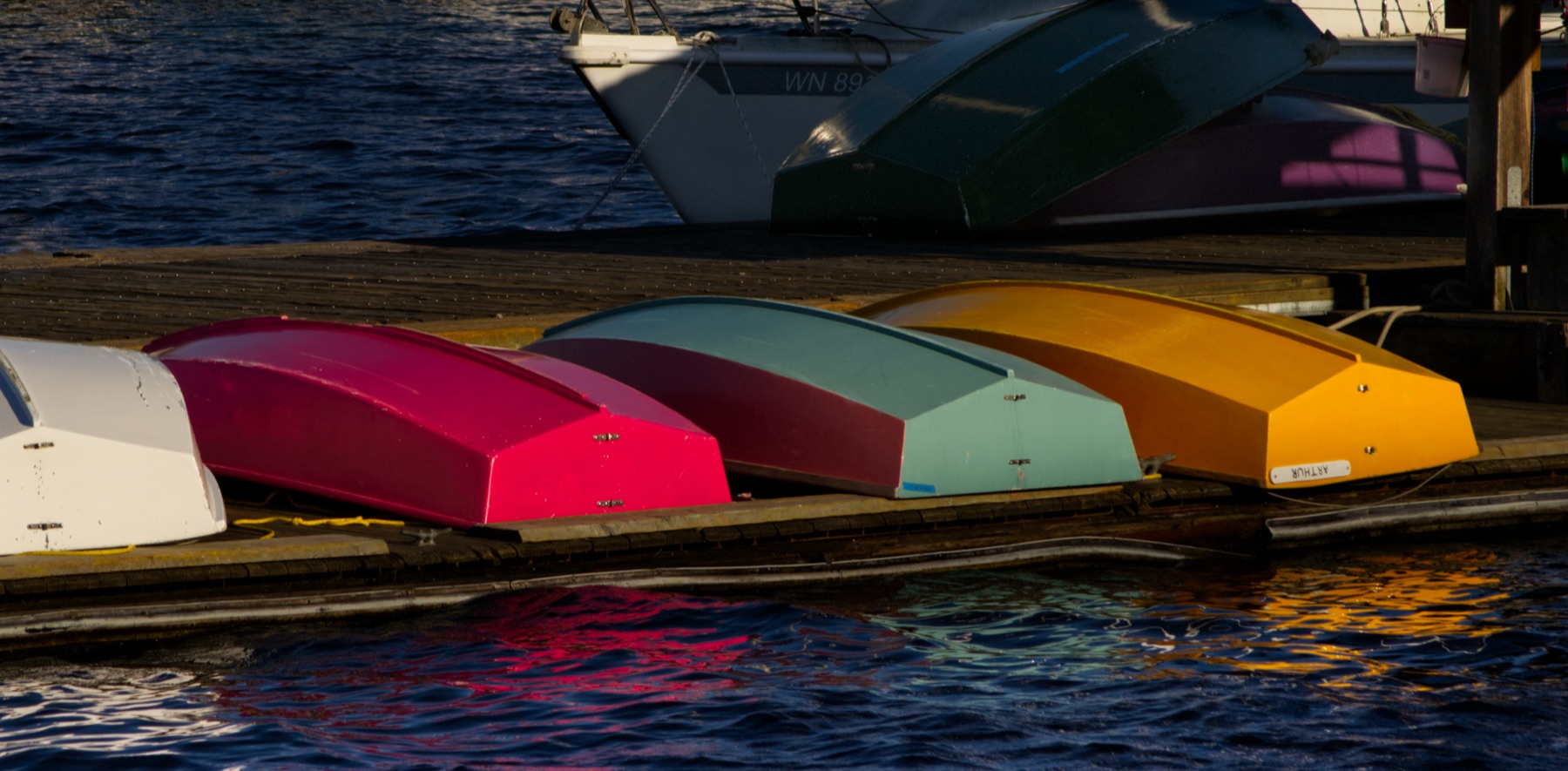 Colorful boats docked at a marina